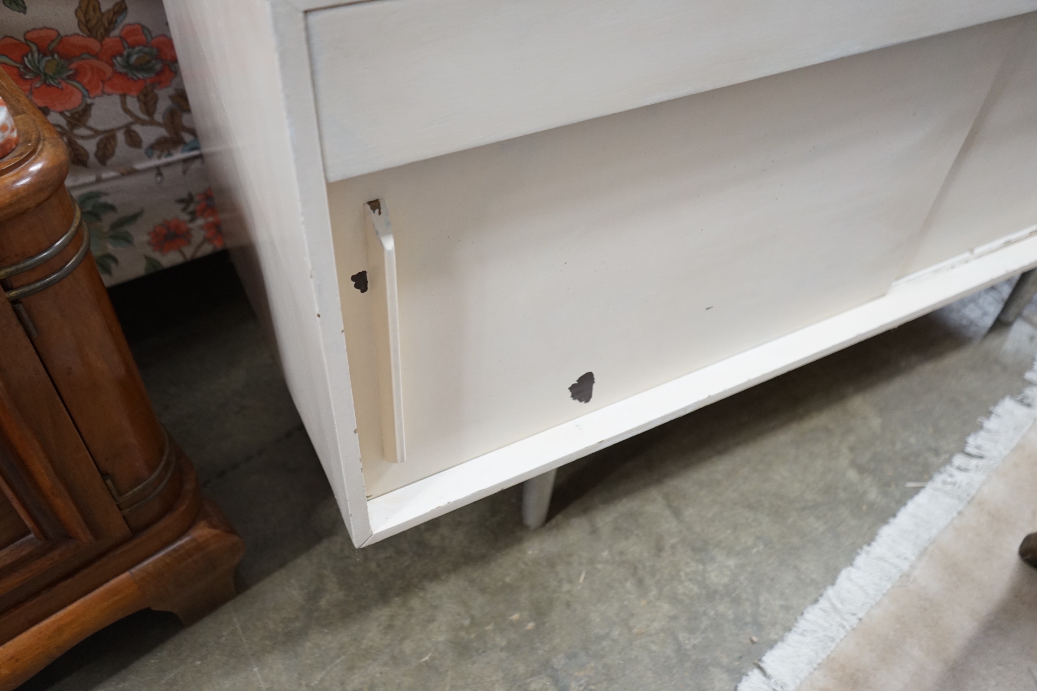 A Robin Day mid century sideboard, later painted, width 137cm, depth 45cm, height 75cm